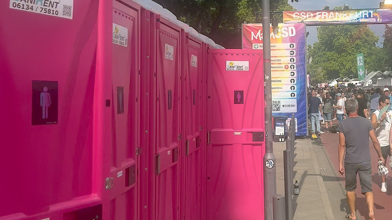 Row of restroom cubicles carrying the CO-WC sign